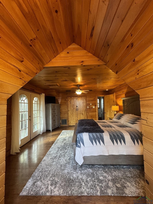 bedroom with access to outside, french doors, wooden walls, vaulted ceiling, and wood ceiling