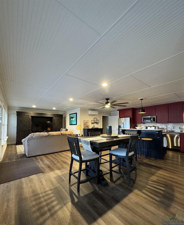 dining room featuring a wall unit AC, ceiling fan, and dark wood-type flooring