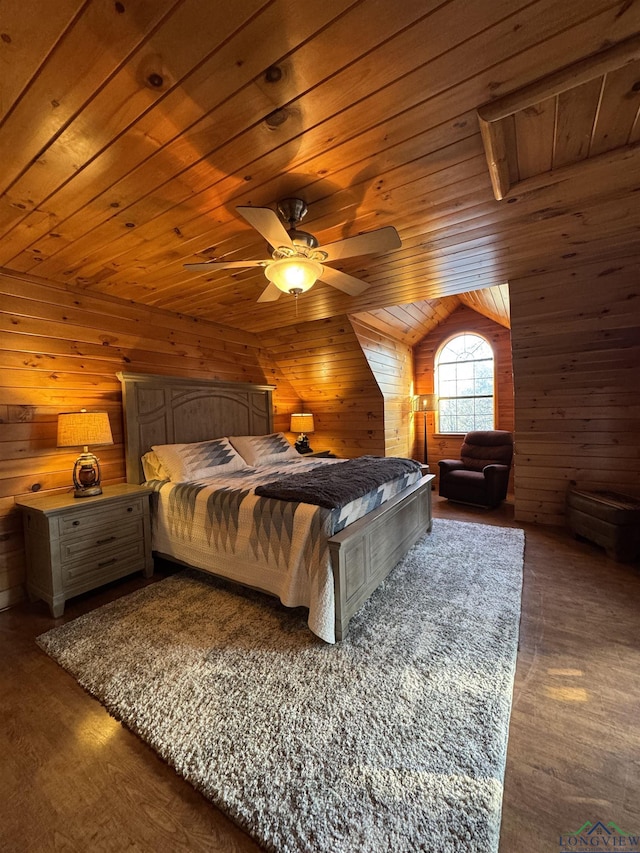 bedroom featuring ceiling fan, wooden ceiling, wooden walls, and vaulted ceiling