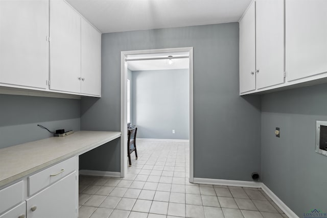 616 Cynthia St, Longview, TX 75605 - washroom featuring cabinet space, light tile patterned floors, baseboards, a desk, and electric dryer hookup
