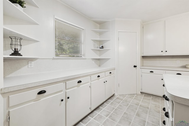 616 Cynthia St, Longview, TX 75605 - kitchen with open shelves, light countertops, white cabinets, and ornamental molding