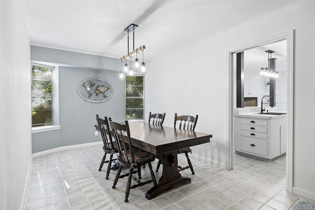616 Cynthia St, Longview, TX 75605 - dining area featuring crown molding, baseboards, and light tile patterned flooring