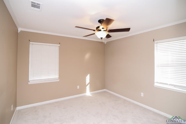 spare room featuring light colored carpet, baseboards, and ornamental molding