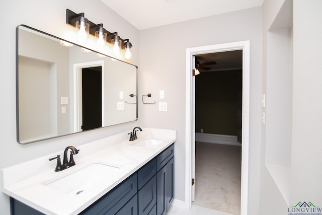 bathroom with a sink and double vanity