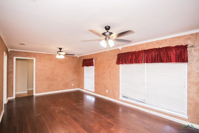 unfurnished room with visible vents, crown molding, baseboards, ceiling fan, and wood finished floors