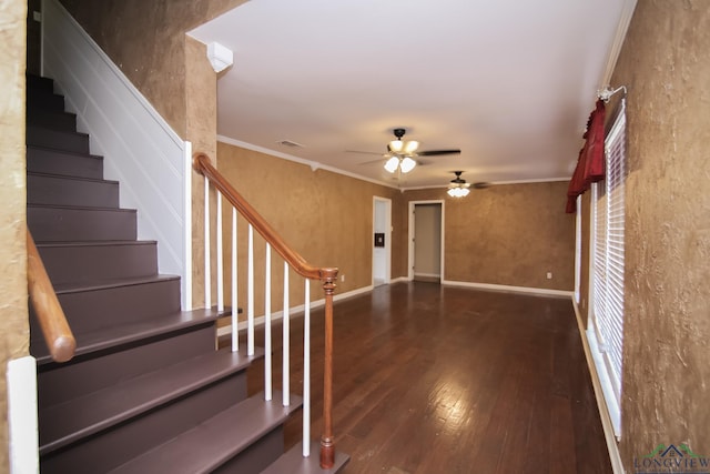 interior space with visible vents, ornamental molding, stairs, and wood finished floors