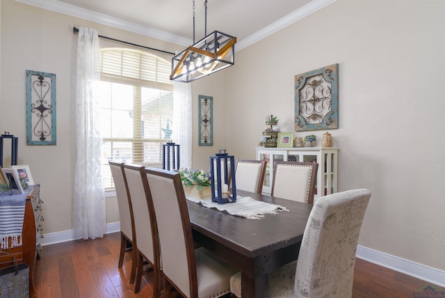 dining space with a healthy amount of sunlight, dark hardwood / wood-style floors, and ornamental molding