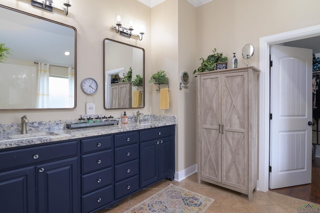 bathroom with tile patterned flooring and vanity