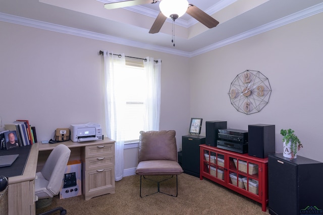 office area with ceiling fan, light carpet, and a tray ceiling