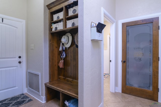 mudroom with light tile patterned floors