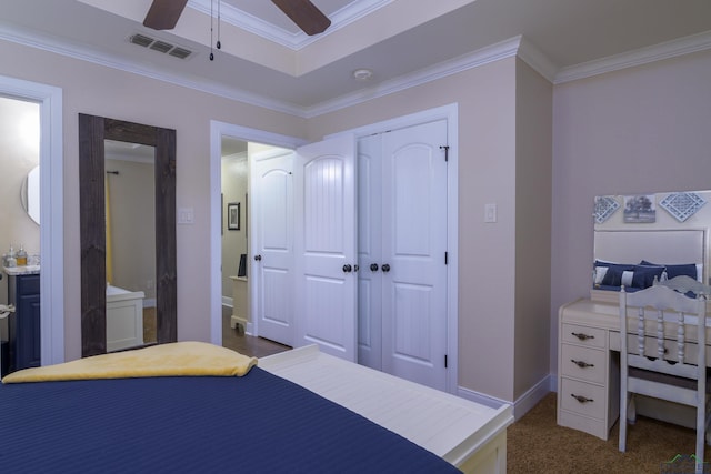 bedroom featuring dark colored carpet, a closet, ceiling fan, and ornamental molding