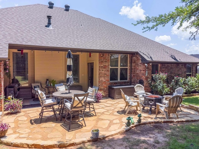 view of patio featuring a fire pit