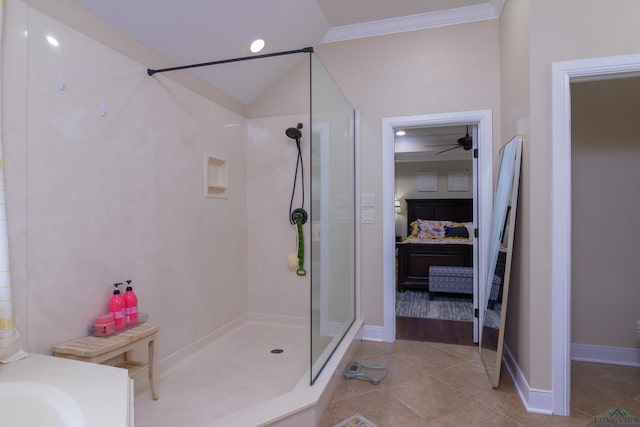 bathroom featuring tile patterned flooring, vaulted ceiling, walk in shower, and ornamental molding