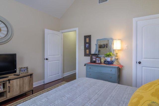 bedroom featuring dark hardwood / wood-style floors and vaulted ceiling