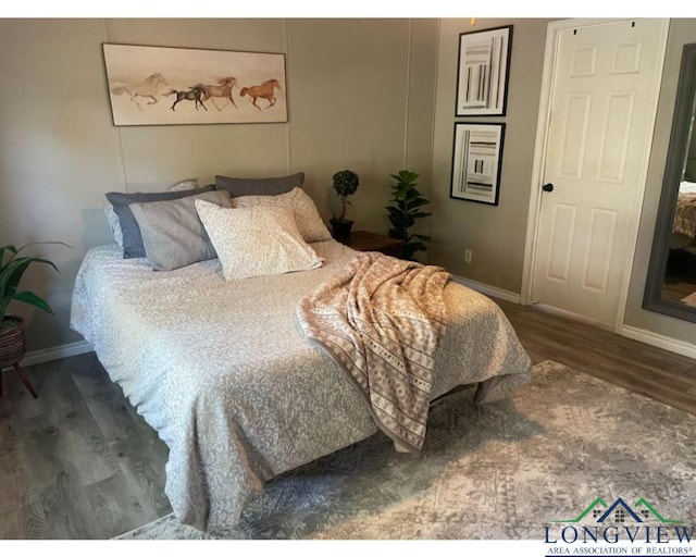 bedroom featuring hardwood / wood-style flooring