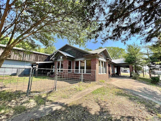 view of front of home featuring a carport