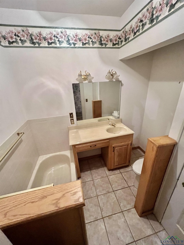 bathroom with tile patterned flooring, toilet, a washtub, and sink