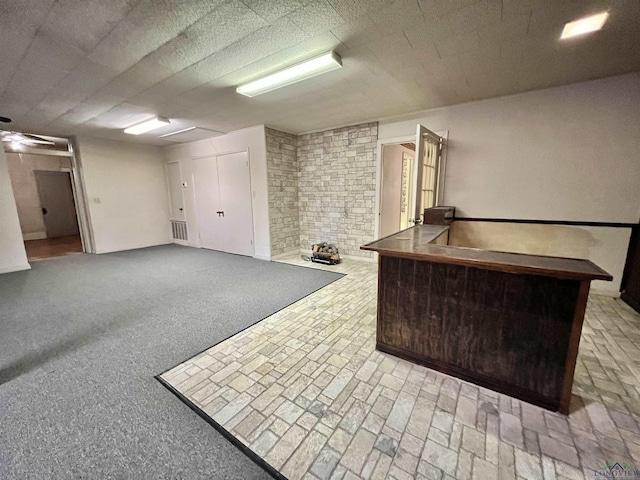 basement featuring light carpet