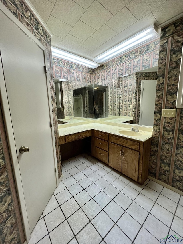 bathroom with tile patterned flooring and vanity