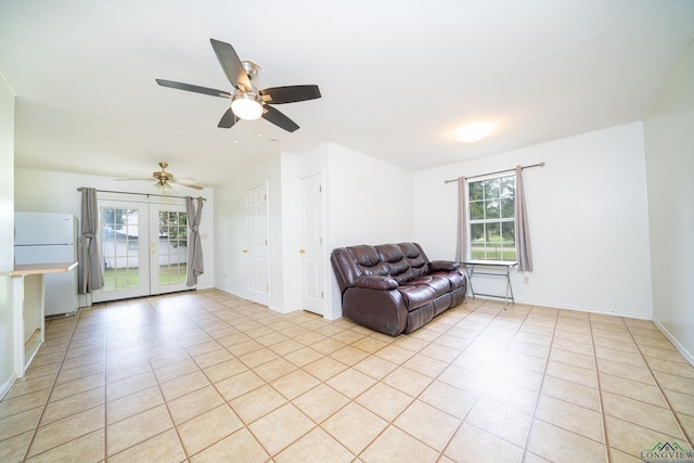 unfurnished room with light tile patterned floors and french doors