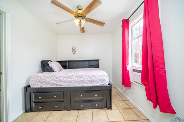 tiled bedroom with ceiling fan and cooling unit