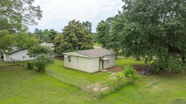 view of outdoor structure featuring a lawn