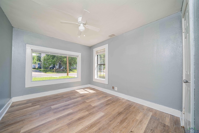 115 Yates St, Mount Vernon, TX 75457 - unfurnished room with wood finished floors, a ceiling fan, and baseboards