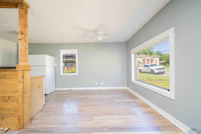115 Yates St, Mount Vernon, TX 75457 - empty room with a ceiling fan, light wood-style floors, and baseboards