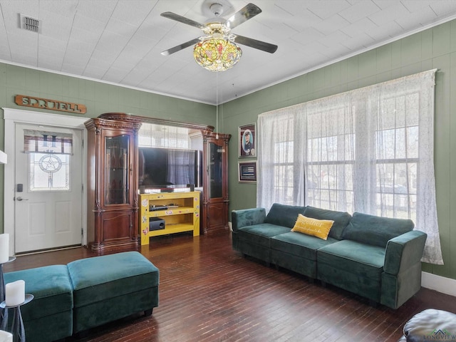 living room featuring visible vents, a ceiling fan, hardwood / wood-style floors, and crown molding