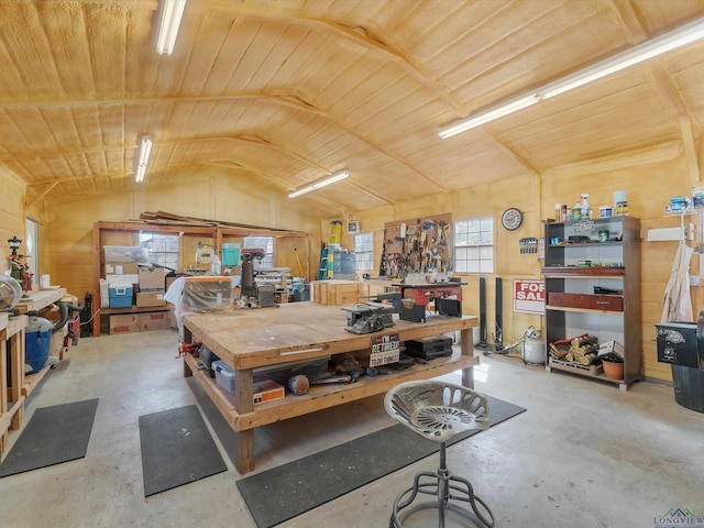 garage with a workshop area and wooden ceiling