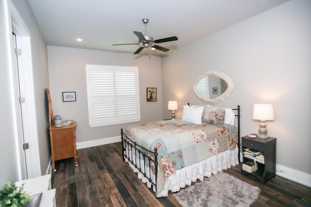 bedroom featuring ceiling fan and dark wood-type flooring