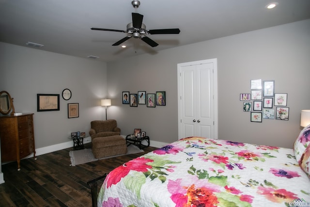 bedroom featuring a closet, ceiling fan, and dark hardwood / wood-style floors