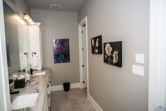 bathroom with vanity and tile patterned floors