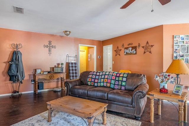 living room with dark hardwood / wood-style floors and ceiling fan