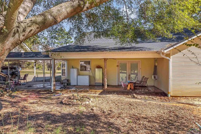 rear view of house featuring french doors and a patio