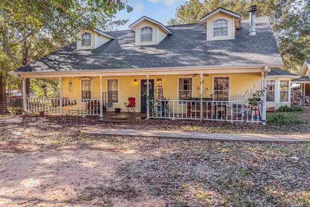 view of front of house with ceiling fan and a porch