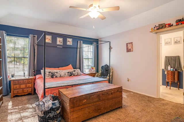 bedroom with carpet flooring, ceiling fan, and multiple windows