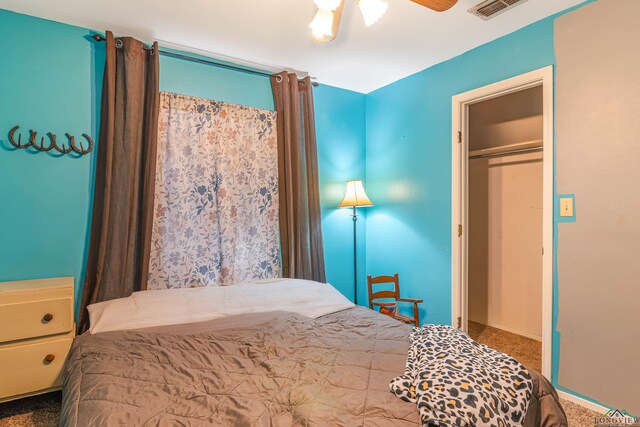 bedroom featuring carpet flooring, ceiling fan, and a closet