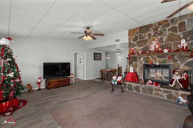 living room with hardwood / wood-style flooring, a paneled ceiling, ceiling fan, and a fireplace