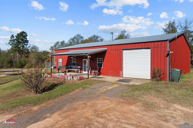 view of outbuilding with a garage