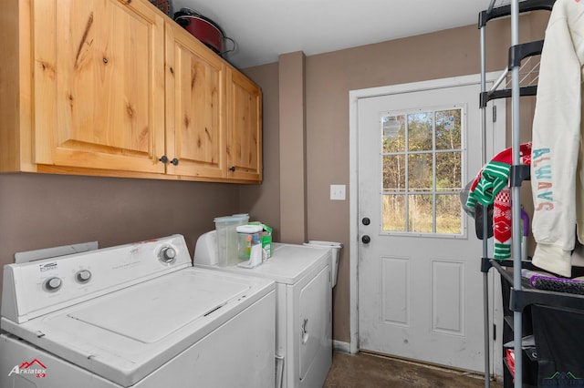 laundry area featuring cabinets and washing machine and clothes dryer