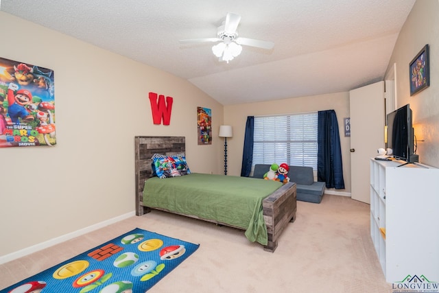 1002 Ruby St, Gilmer, TX 75644 - bedroom featuring light colored carpet, vaulted ceiling, a ceiling fan, and baseboards