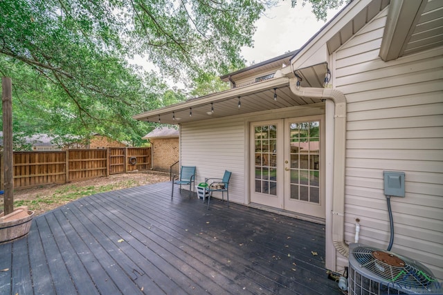 1002 Ruby St, Gilmer, TX 75644 - deck with central air condition unit, french doors, and fence