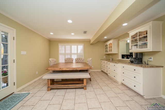 1002 Ruby St, Gilmer, TX 75644 - dining room with recessed lighting, visible vents, light tile patterned flooring, crown molding, and baseboards