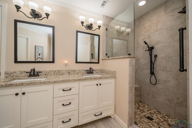 1002 Ruby St, Gilmer, TX 75644 - full bathroom featuring visible vents, a walk in shower, and a sink