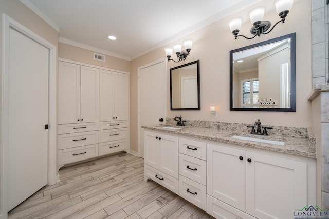 1002 Ruby St, Gilmer, TX 75644 - full bathroom featuring double vanity, visible vents, ornamental molding, and a sink