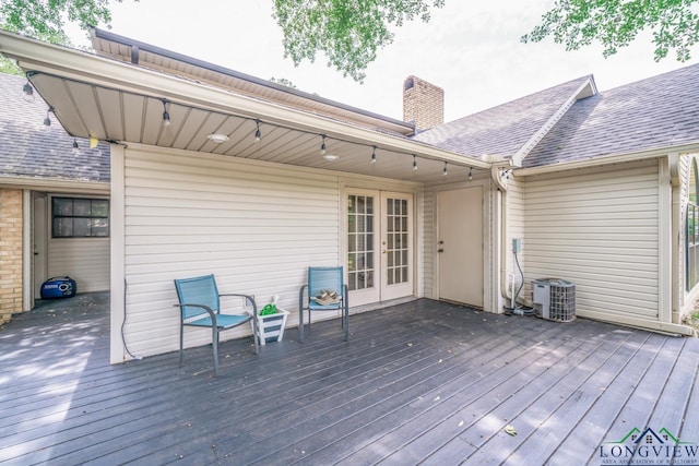 1002 Ruby St, Gilmer, TX 75644 - deck featuring central air condition unit and french doors