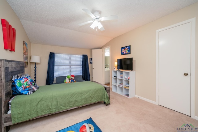 1002 Ruby St, Gilmer, TX 75644 - carpeted bedroom with baseboards, vaulted ceiling, a ceiling fan, and a fireplace