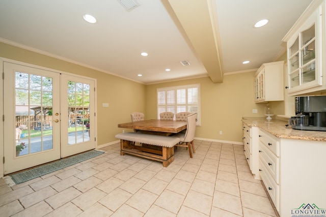 1002 Ruby St, Gilmer, TX 75644 - dining room featuring plenty of natural light, ornamental molding, and french doors