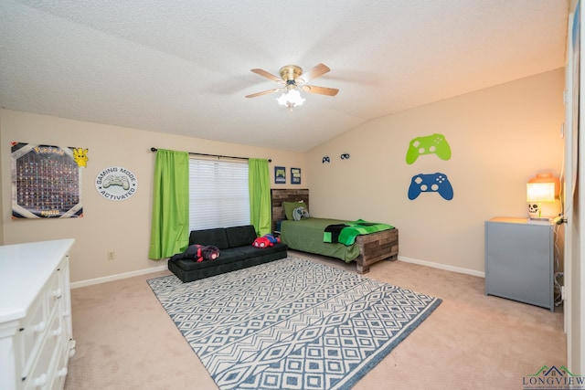 1002 Ruby St, Gilmer, TX 75644 - bedroom featuring vaulted ceiling, baseboards, a textured ceiling, light colored carpet, and ceiling fan